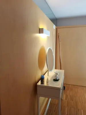 a bathroom with a white table with a mirror on it at Gloria's Design House in Santiago de Compostela