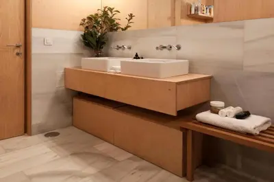 a bathroom with a sink and a counter with towels at Gloria's Design House in Santiago de Compostela