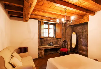 a living room with a couch and a table at Casa Lourán in Monfero