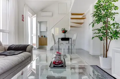 a living room with a couch and a glass table at Rueiro 17 in A Coruña