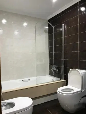 a bathroom with a tub and a toilet and a sink at High Rentxacobeo in Sarria