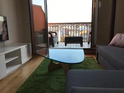a living room with a glass table and a couch at High Rentxacobeo in Sarria