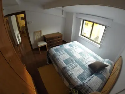 a small bedroom with a bed and a window at Alojamientos turísticos VUT-LE-043 in Villablino