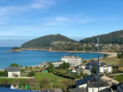 a view of a town and a body of water at Hotel Ego in Viveiro