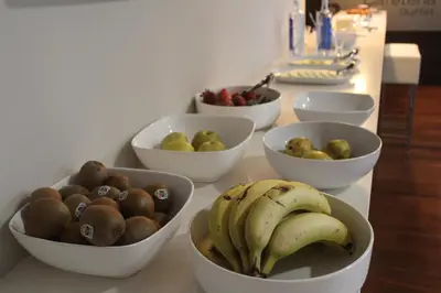 a group of bowls of fruit on a counter at Hotel Ego in Viveiro