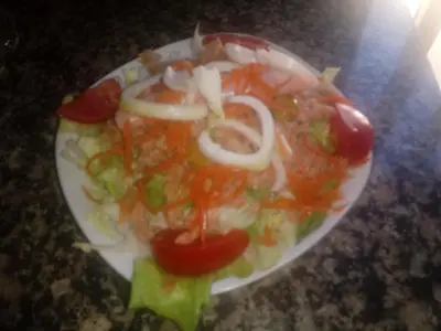 a plate of food with vegetables on a table at Casa Quiroga in Lamas