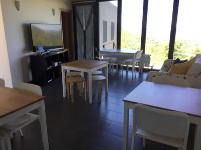 a room with two bunk beds and a table at Linar Do Rei in Linares