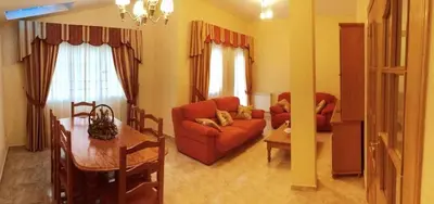 a living room with a couch and a table at Casa Rural Elias in Molinaseca