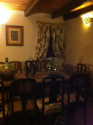 a dining room with a table and some chairs at Casa Rural Pico del Lugar in Villar de los Barrios