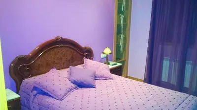 a purple bedroom with a bed with purple walls at Elegant House in Pontevedra + Private Pool in Rífrío