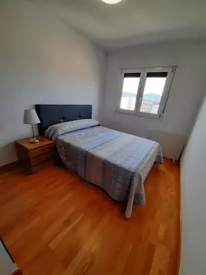 a bedroom with a bed and a window at Lugomar in Foz
