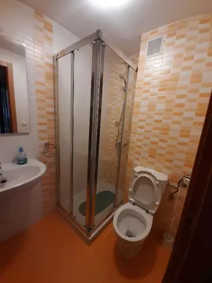 a bathroom with a shower and a toilet and a sink at Lugomar in Foz