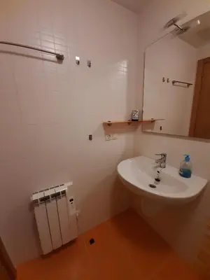 a bathroom with a sink and a mirror at Lugomar in Foz