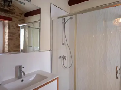 a bathroom with a shower and a sink at Casa Xan in Jove
