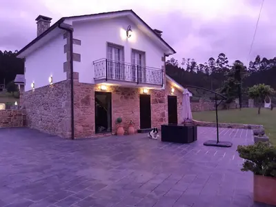 a white house with a patio in front of it at Casa Xan in Jove