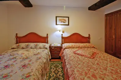 a bedroom with two beds next to each other at Casal de Drados in Drados