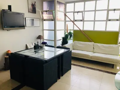 a living room with a couch and a table at Albergue la Estacion Santiago de Compostela in Santiago de Compostela