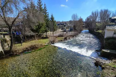 a river with white rapids on the side of it at Casas Rurales Trefacio in Trefacio