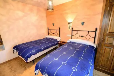 two beds sitting next to each other in a bedroom at Casas Rurales Trefacio in Trefacio