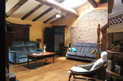 a living room with two couches and a table at Casa Rural Chao de Castro in Ríodeporcos