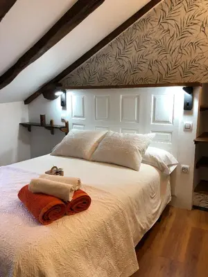 a bedroom with a bed with two towels on it at Casa Rural Chao de Castro in Ríodeporcos
