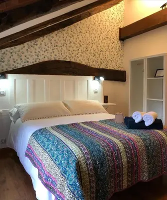 a bedroom with a bed with two towels on it at Casa Rural Chao de Castro in Ríodeporcos