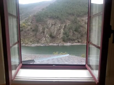 an open window with a view of a mountain at Hotel Las Grandas in Vistalegre