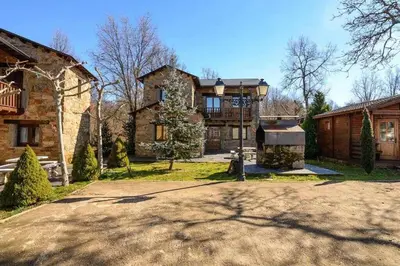 a large house with a driveway in front of it at Casas Rurales San Justo in San Justo