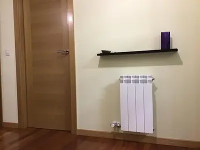 a room with a door and a shelf on the wall at Apartamento Lua in Milladoiro