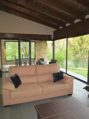 a living room with a couch and a table at Alojamientos Marel Sanabria in Villarino de Sanabria