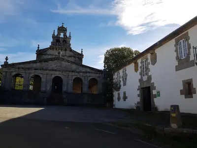 an old building with a tower on top of it at Pazo Vilabade in Vilabade