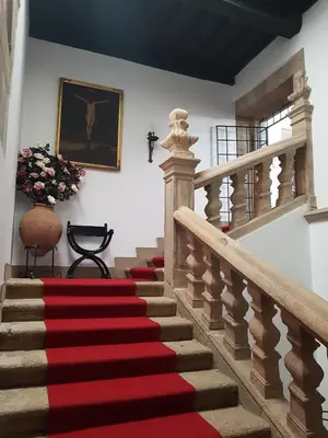 a red carpeted staircase in a house at Pazo Vilabade in Vilabade