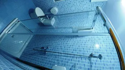 a bathroom with a shower with a toilet and a mirror at Casa Tia Teresa in Salceda