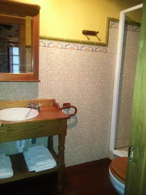 a bathroom with a sink and a toilet at Casa Colason in El Otero