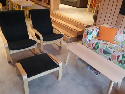 a room with two chairs and a couch and a table at Albergue Milladoiro in Milladoiro