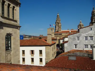 a view of a city from the roofs of buildings at Pensión O Códice by Moradas Nieto in Santiago de Compostela