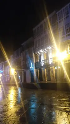 a group of buildings at night with lights at PICO SACRO I HOSTAL-PENSION Santiago de Compostela in Santiago de Compostela