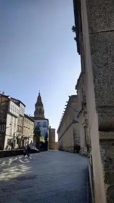 an empty street in a city with buildings at PICO SACRO I HOSTAL-PENSION Santiago de Compostela in Santiago de Compostela
