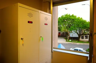 an open door to a window with a view of a street at Albergue Mirás in Sigüeiro