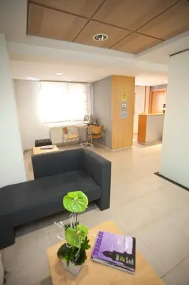 a living room with a couch and a table at Hotel Metropol by Carris in Lugo