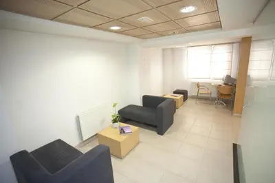 an office with couches and a table in a room at Hotel Metropol by Carris in Lugo