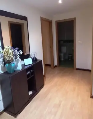 a bedroom with a bed and a table with a chair at Castelao Apartments in Arzúa