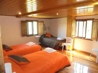 a room with two beds in a room at Casa Saleta in Melide
