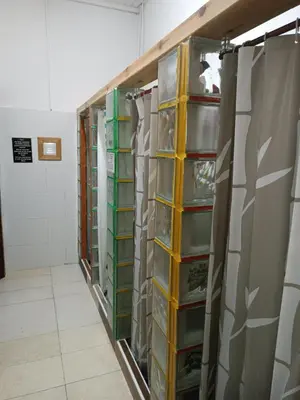 a row of shelves in a room filled with dishes at Pensión y Albergue Matias Locanda in Sarria
