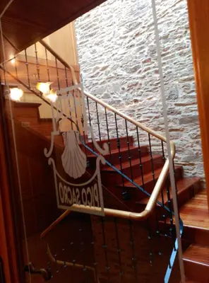a spiral staircase in a boat with a large window at PICO SACRO II HOTEL Santiago de Compostela in Santiago de Compostela