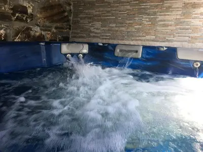 a pool of water in the floor of a building at Os Arroxos in Trabadelo