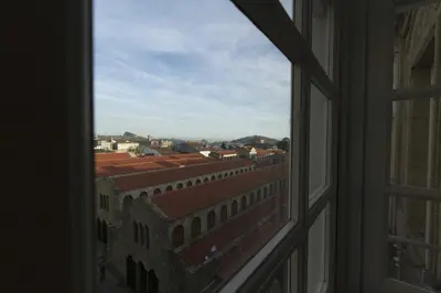 an open window with a view of a city at Hotel Pazo de Altamira in Santiago de Compostela