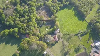 an aerial view of a house in a field at Hosteria Calixtino in Palas de Rei