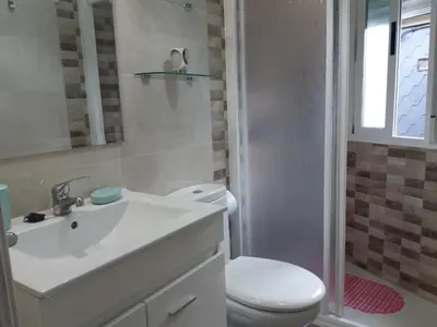 a bathroom with a white sink and a toilet at Casa Gelita in Casayo