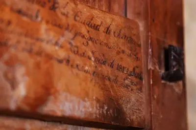 an old wooden chest with writing on it at Casa Pepa Hotel Rural in Santa Colomba de Somoza